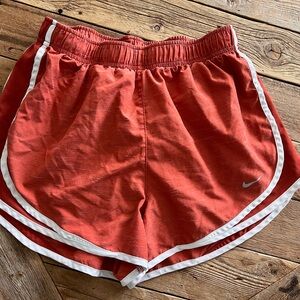 Size M Nike Dri-Fit Women's Athletic Shorts in burnt orange with White Trim